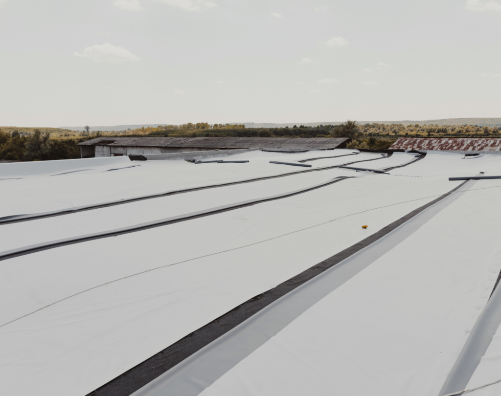 Completed flat roof project highlighting TPO Roofing near me in Waco, TX performed by experienced local roofing professionals