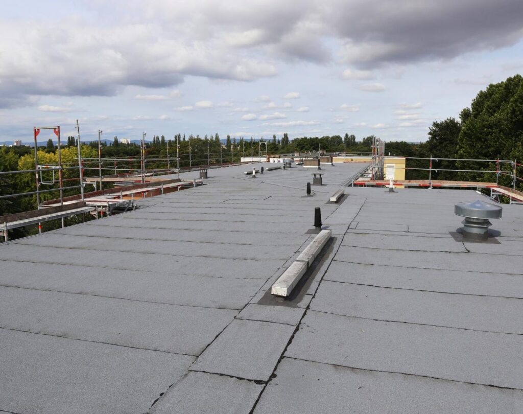 Completed flat roof showcasing Modified Bitumen Roofing in Hewitt, TX installed for long-term waterproofing and durability